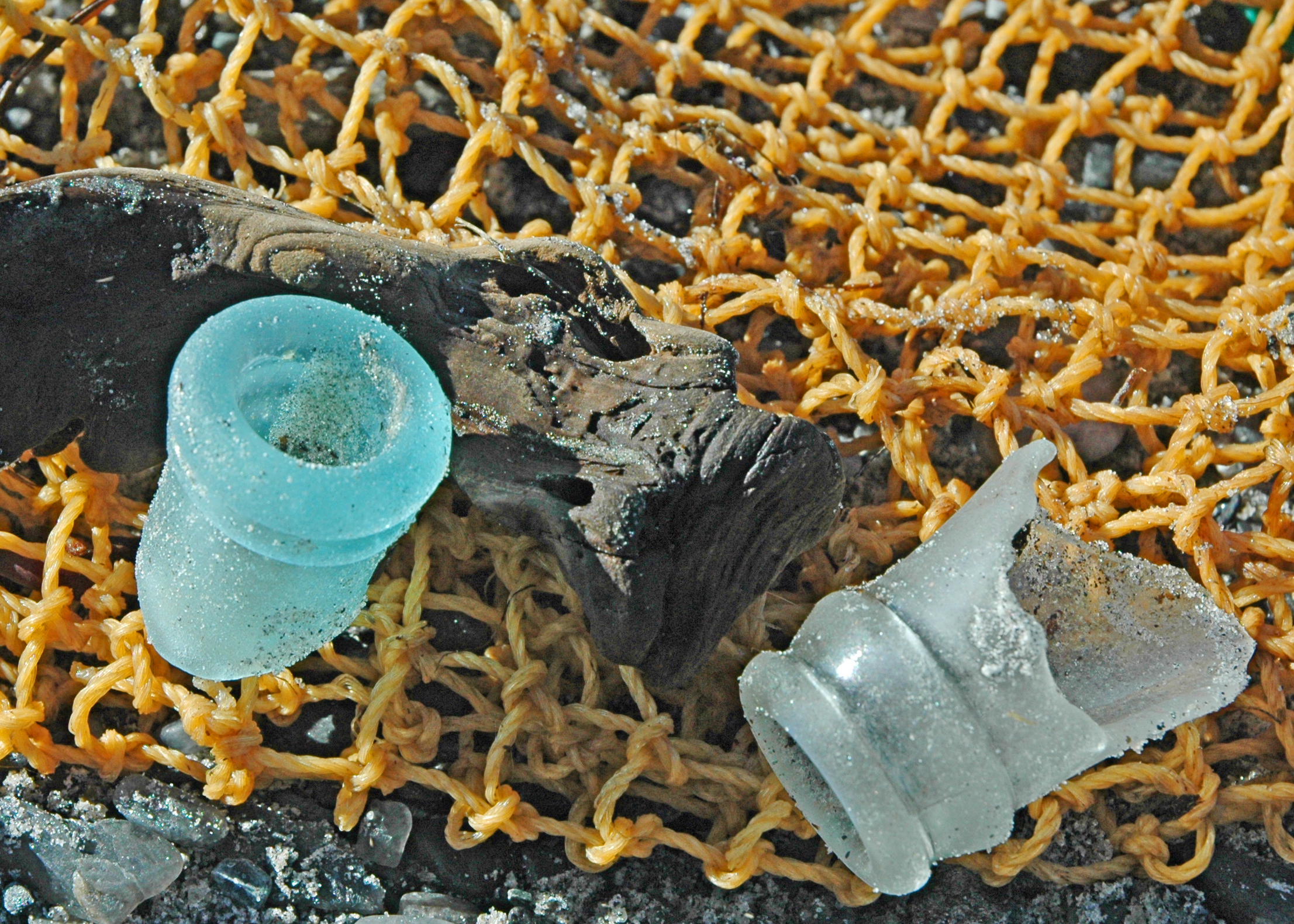 white and teal Sea glass bottle necks with orange bait bag